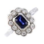 An 18ct gold sapphire and diamond cluster ring. The rectangular-shape sapphire, within a brilliant-