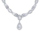 A diamond necklace. The baguette and brilliant-cut diamond pear-shape cluster, suspended from a