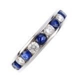 A sapphire and diamond half-circle eternity ring. The alternating brilliant-cut diamond and