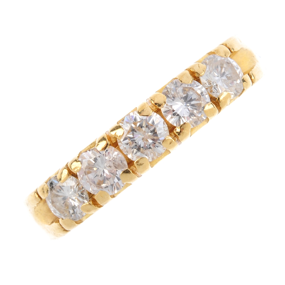 A diamond five-stone ring. The brilliant-cut diamond line, with scalloped sides. Estimated total