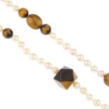 A cultured pearl and tigers-eye quartz single-strand necklace. Designed as a series of seventy