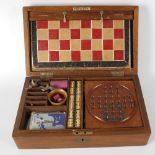 A Victorian mahogany cased games compendium, the rectangular case with hinged opening cover