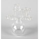 A Lalique 'Clairefontaine' scent bottle, of spherical form, the stopper modelled as small Lily of