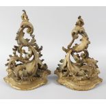 A pair of giltwood and gesso wall brackets, each of ornate stylised form, 10.25 (26cm) high. Each in