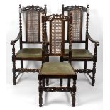 A set of six (4 + 2 arm) oak dining chairs, each having a cane-work panel to the foliate carved back