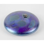 A John Ditchfield Glasform paperweight, of iridescent blue glass, decorated with painted lily pads