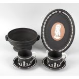 A group of Wedgwood black basalt wares, comprising: a 'Venus and Cupid' oval tray, from the Noble