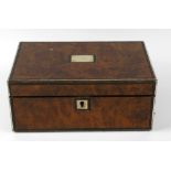 A Victorian brass-bound burr walnut lap desk. The hinged rectangular cover centred by a vacant