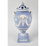 A rare Wedgwood Royal commemorative blue jasperware trial vase and cover, made as a prototype for