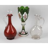 A Bohemian overlay glass vase, circa 1900, the white-on-green castellated ovoid body with shaped