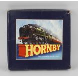 A box containing a selection of Hornby 0 gauge model railway items, to include a tank goods set No