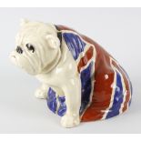 A Royal Doulton study of a bulldog seated and draped in the Union flag, being a caricature of