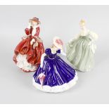 A group of nine Royal Doulton figurines, comprising Lorraine HN3118, Top O'The Hill HN1834, Gift