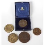 Five assorted medallions to include bronze Notre Dame Cathedral example, another French medallion,