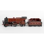 A Hornby 0 gauge tinplate and metal bodied clockwork model railway LMS 4-4-0 compound locomotive and