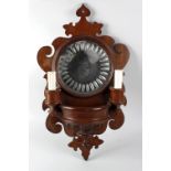 A Victorian mahogany wall mirror, of girandole type, the circular plate with border of oval