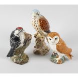 A group of five Beswick birds, comprising a Kestrel, a Woodpecker, a Barn Owl, a Stonechat (a/f),