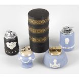 A collection of sixteen Wedgwood jasperware cigarette lighters, to include an unusual three-