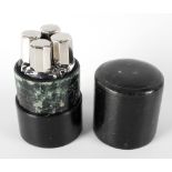 An early 20th century cased set of scent bottles, the outer green leather covered cylindrical case