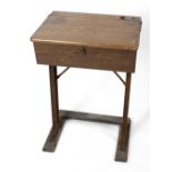 A mid 20th century oak school desk, with lidded brass inkwell, marked 'Kingfisher, West Bromwich',