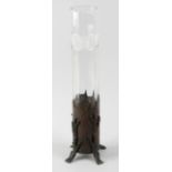 An unusual glass vase, the cut cylindrical sleeve within a bronzed base modelled as the trunk of a