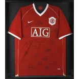 A framed and glazed Manchester United Nike football shirt, circa 2006/7, signed in black marker by