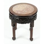 A Chinese marble topped hardwood side table or vase stand, the circular top having inset pink marble