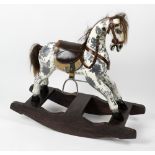 A small 20th century dapple grey rocking-horse With horse-hair mane and tail, leather seat with