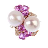 A South Sea Cultured pearl, diamond and sapphire dress ring. The twin South Sea cultured pearls,