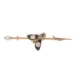 A late Victorian gold, enamel and gem-set bee brooch. The striped black enamel and old-cut diamond