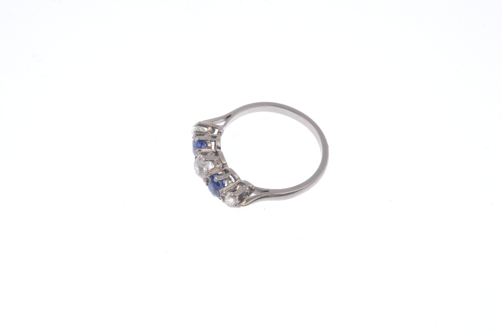 A mid 20th century diamond and sapphire five-stone ring. The alternating graduated old-cut diamond - Image 3 of 4