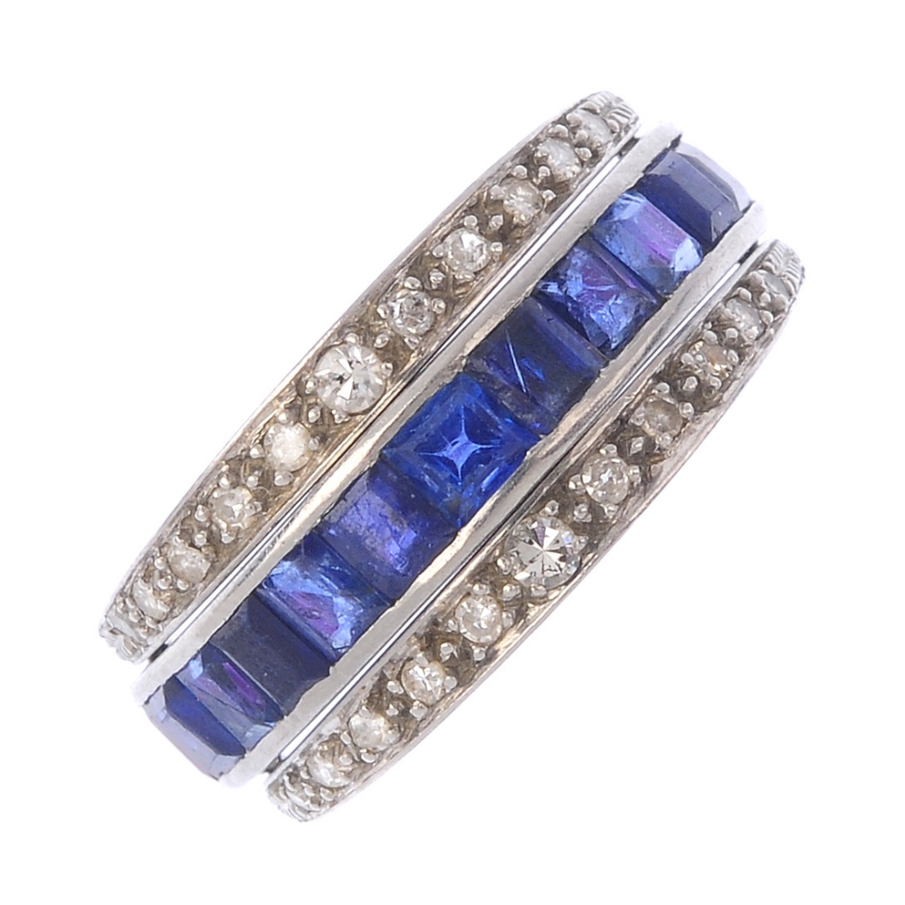 A sapphire, ruby and diamond flip ring. The calibre-cut sapphire and ruby full-circle eternity ring,