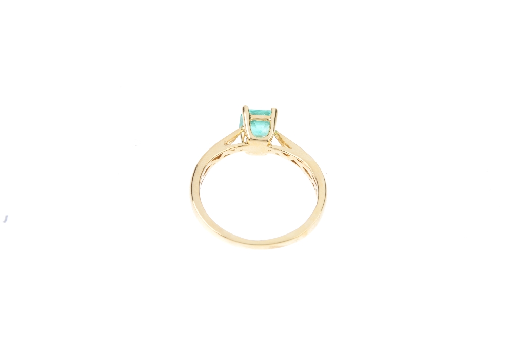 An 18ct gold Colombian emerald single-stone ring. The rectangular-shape Colombian emerald, with - Image 3 of 3