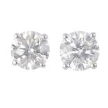 A pair of 18ct gold brilliant-cut diamond stud earrings. Total diamond weight 1ct, stamped to mount,