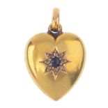 A late Victorian 15ct gold sapphire and diamond pendant. The heart, with oval-shape sapphire and