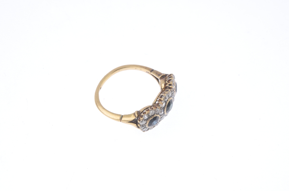 A mid 20th century 18ct gold sapphire and diamond triple cluster ring. Comprising three slightly - Image 4 of 4