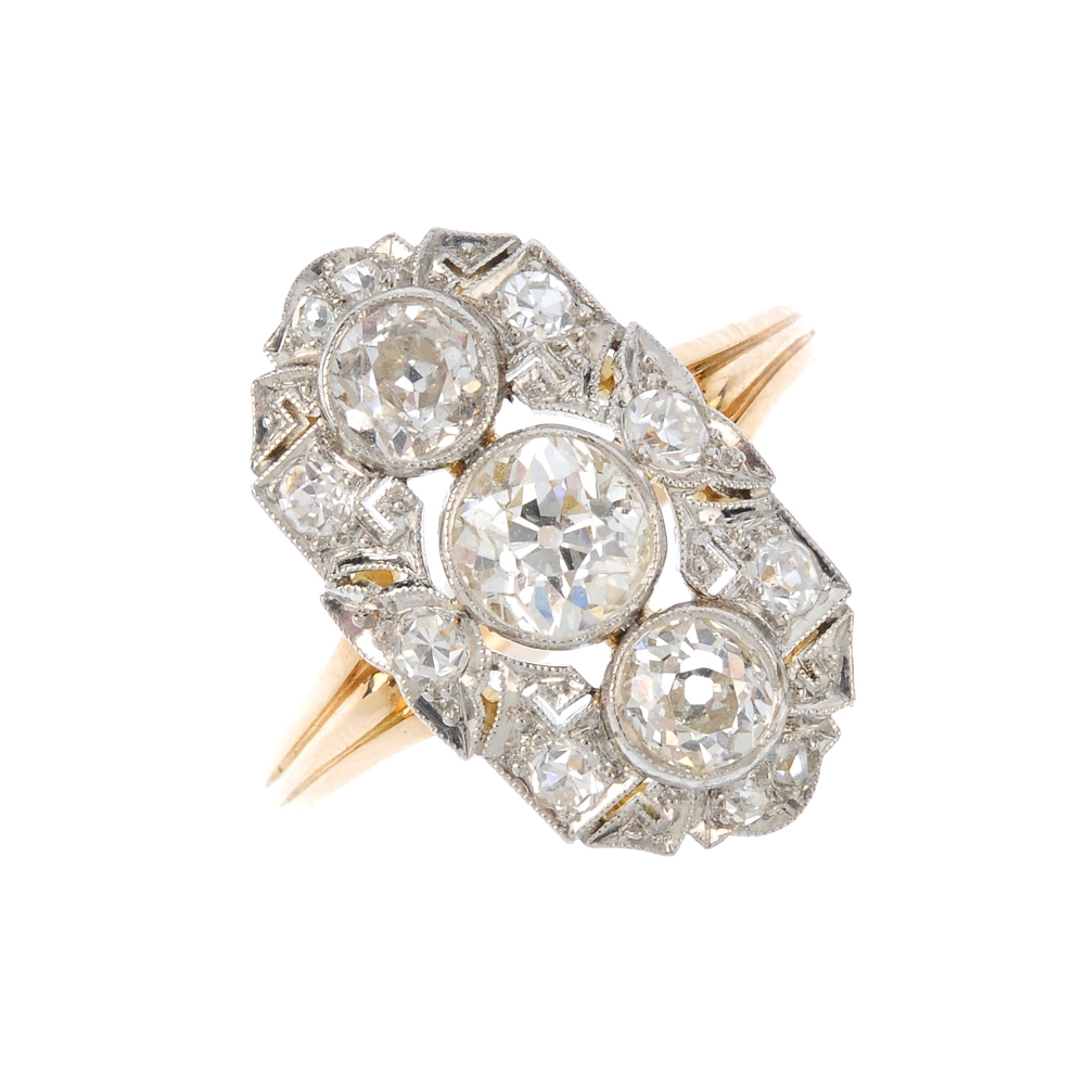 An early 20th century gold and platinum diamond dress ring. Designed as three graduated old-cut