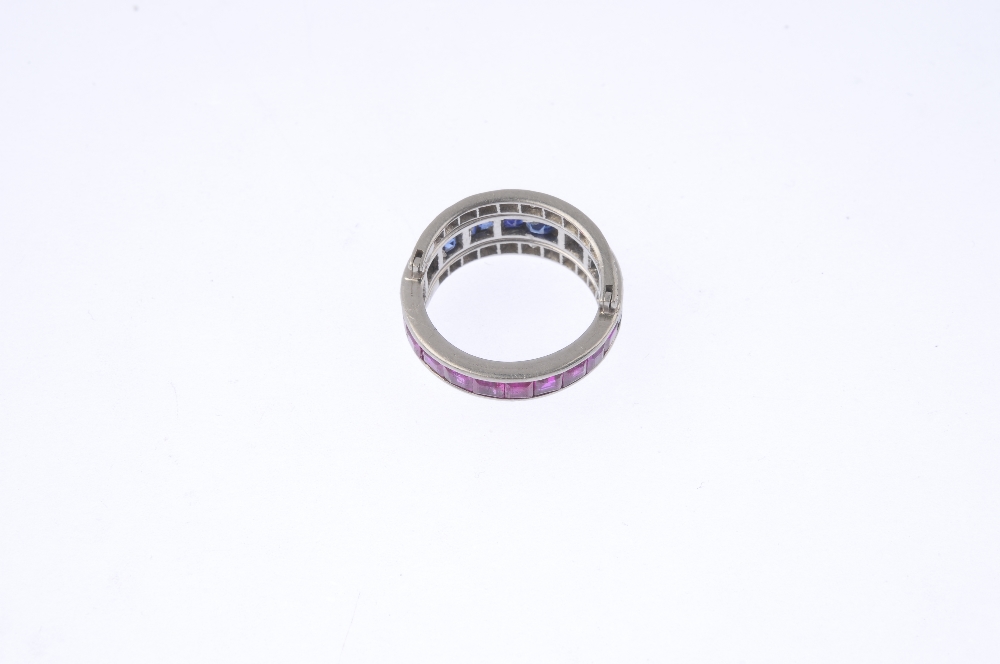 A sapphire, ruby and diamond flip ring. The calibre-cut sapphire and ruby full-circle eternity ring, - Image 5 of 5