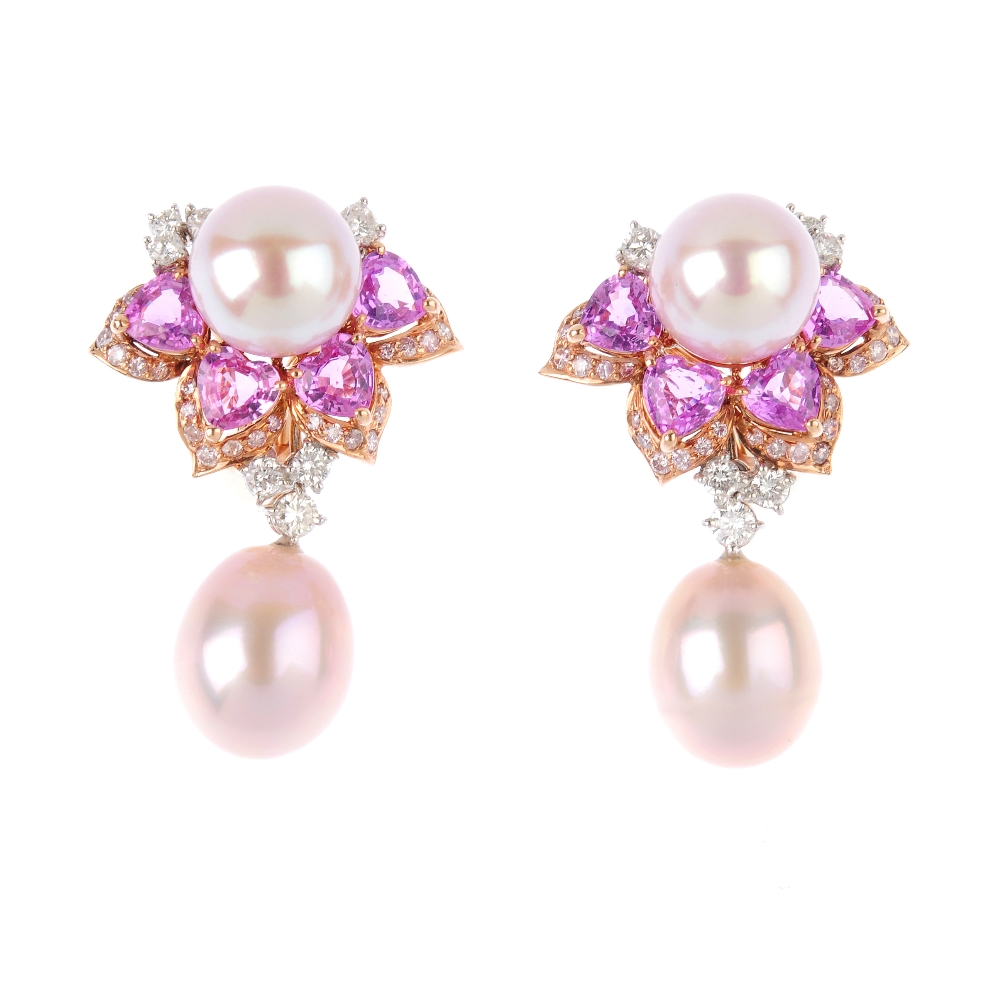 A pair of gem-set floral earrings. Each designed as a cultured pearl, suspended from a brilliant-cut