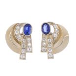 A pair of mid 20th century synthetic sapphire and diamond earrings. Each designed as an oval-shape