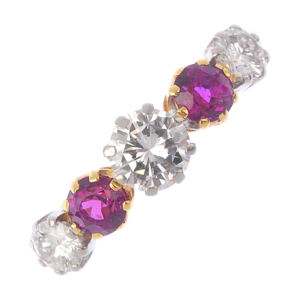 An 18ct gold diamond and ruby five-stone ring. The alternating, graduated brilliant-cut diamond