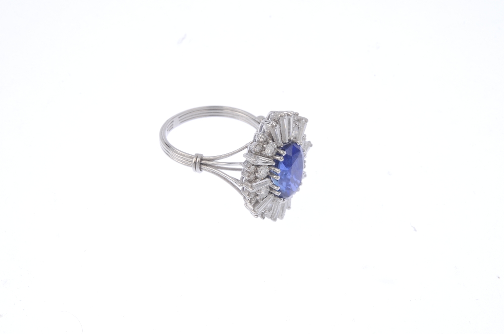 An 18ct gold Burmese sapphire and diamond cocktail ring. The oval-shape sapphire, with alternating - Image 4 of 4