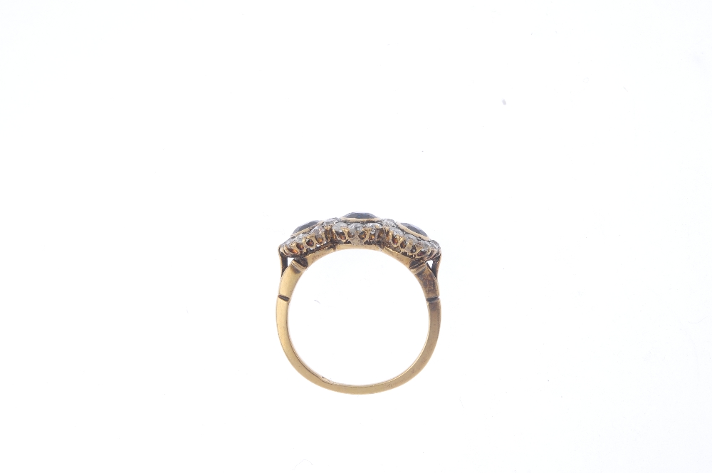 A mid 20th century 18ct gold sapphire and diamond triple cluster ring. Comprising three slightly - Image 2 of 4