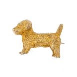 An early 20th century 9ct gold dog brooch. Designed as a textured Terrier. Length 2.3cms. Weight 8.