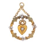 An early 20th century 15ct gold split pearl pendant. Designed as a split pearl heart and lovers knot