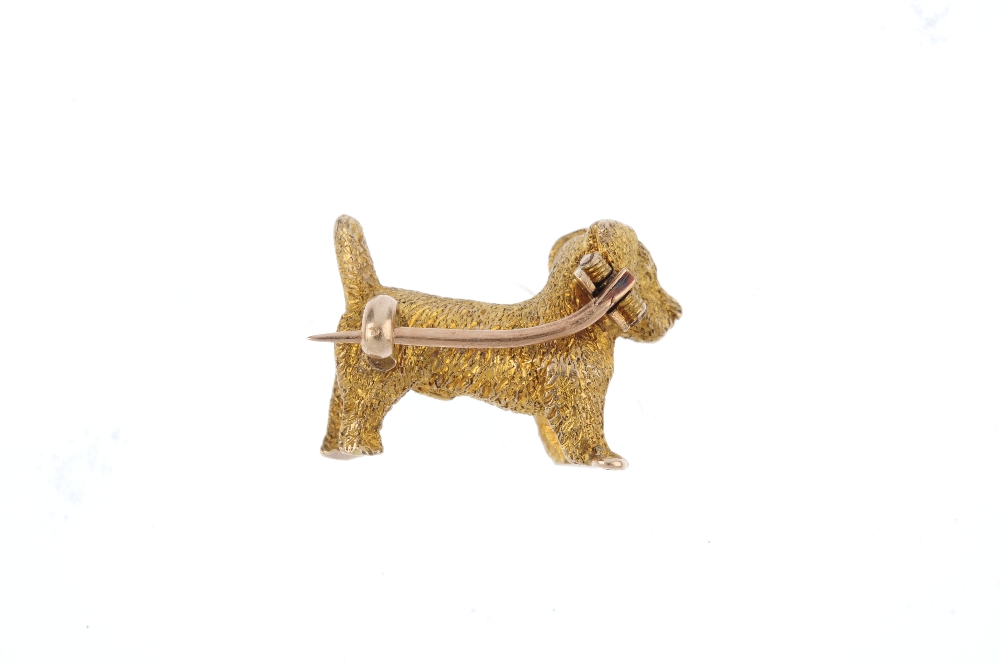 An early 20th century 9ct gold dog brooch. Designed as a textured Terrier. Length 2.3cms. Weight 8. - Image 2 of 2