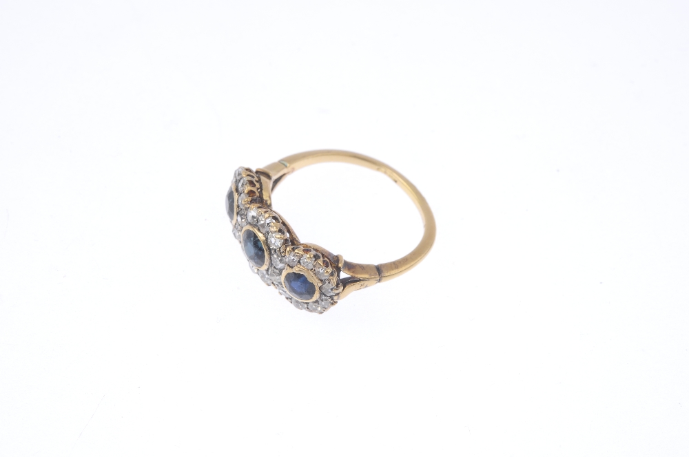 A mid 20th century 18ct gold sapphire and diamond triple cluster ring. Comprising three slightly - Image 3 of 4