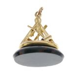 A Masonic bloodstone fob. The oval bloodstone set to a flat mount, the pedestal comprising Masonic
