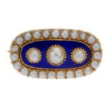 A late Victorian split pearl and blue enamel brooch. The oval shape blue enamel panel, set with