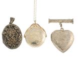 A selection of silver and white metal lockets. To include a heart-shape locket with foliate